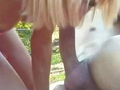 Blonde tranny rides dude cock outside